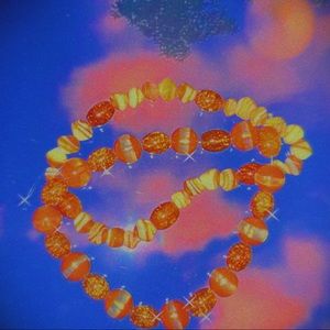 Orange and white beaded bracelet.